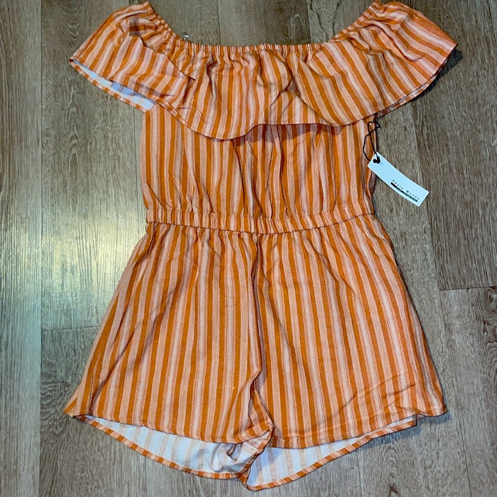 Young contemporary off shoulder romper with white design.